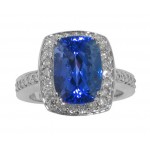 8.37 CT. TW Cushion Cut Tansanite In Round Diamond Halo Accented 14 KT Ring